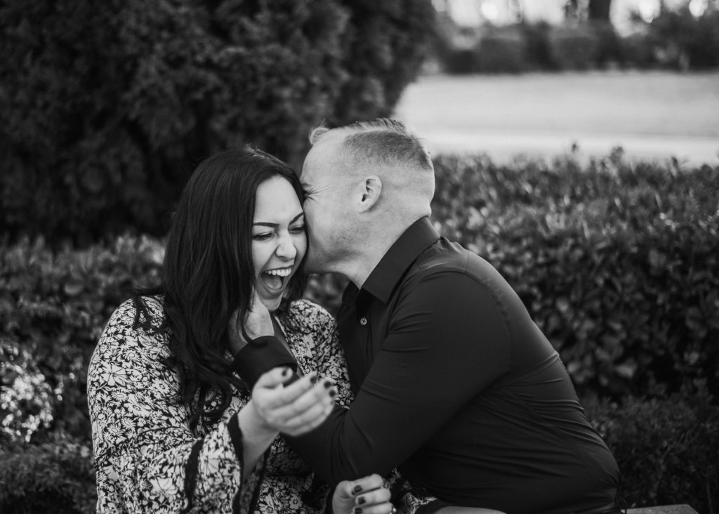 couple laughing, black and white image
